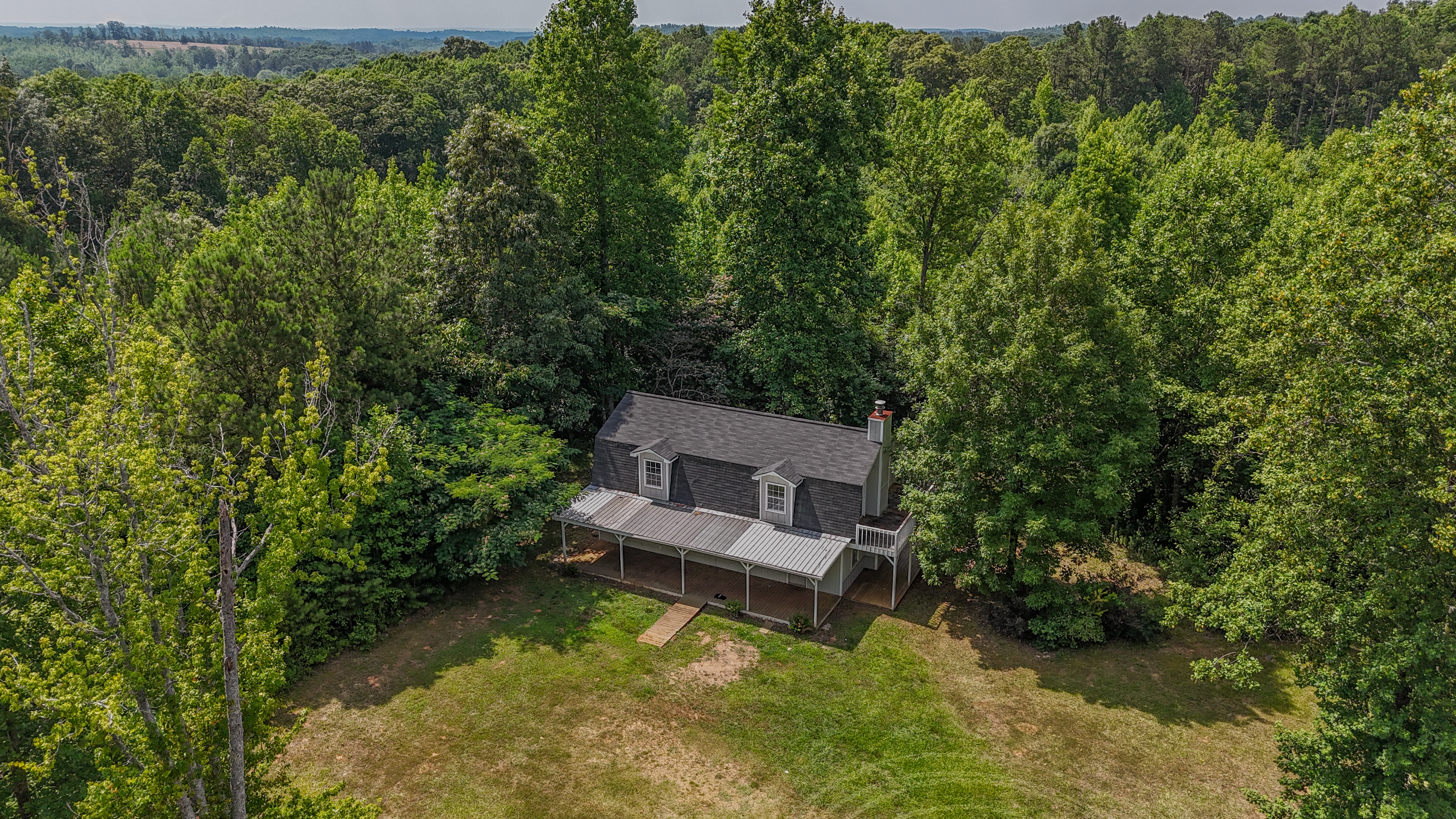 angled drone shot of front of property